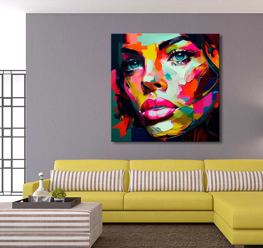Françoise Nielly-signature - Gaby by Night: A bold pop-art portrait of a woman’s face, vibrant and expressive, hangs above a modern yellow sofa in a contemporary living room.