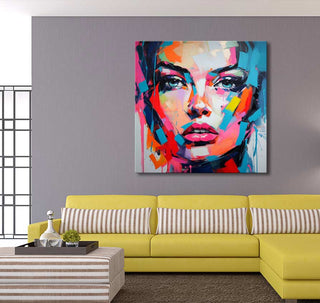 Françoise Nielly-signature 'Isabel in the Morning' painting features a woman's face in vibrant, abstract colors, adding dynamic energy to a modern living space.