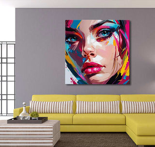 Françoise Nielly's Rebecca by Night pop-art portrait on gray wall, above yellow sofa; vibrant, expressive hand-painted artwork for modern interiors.