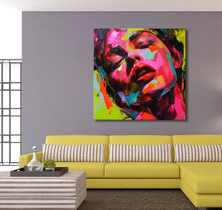 Françoise Nielly-signature 'Jody by Night' painting, abstract woman's face, vibrant strokes. Displayed above a modern chartreuse L-shaped sofa in a contemporary living room setting.