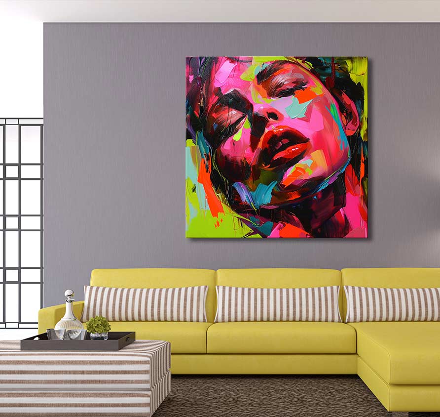 Françoise Nielly-signature 'Jody by Night' painting, abstract woman's face, vibrant strokes. Displayed above a modern chartreuse L-shaped sofa in a contemporary living room setting.