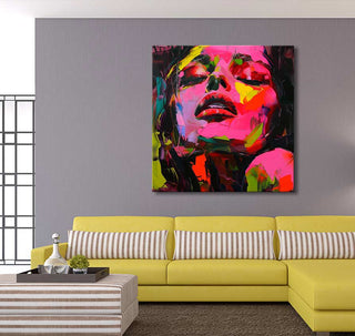 Françoise Nielly's Jasmin by Night painting, an expressive abstract portrait of a woman's face, displayed above a modern chartreuse sofa in a bright living room.