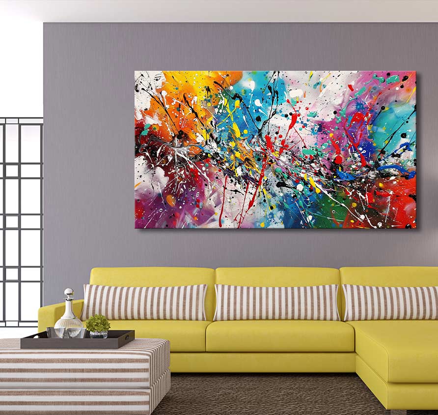 Modern living room featuring Jackson Pollock signature - The Bright Side abstract canvas in vibrant colors, above a yellow L-shaped sofa and striped ottoman.