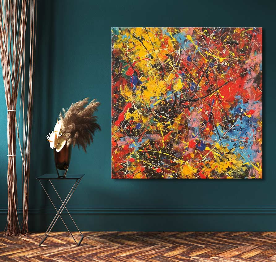 Jackson Pollock-style abstract painting Spring has Sprung, vibrant drip art on canvas, displayed in a stylish interior with minimalist decor against a teal-green wall.
