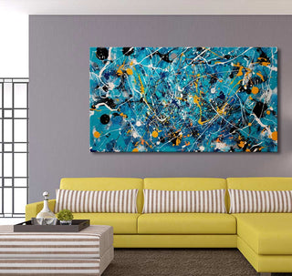 Jackson Pollock signature – Aquatic: A vibrant abstract oil painting in turquoise, white, black, and yellow, displayed in a modern living room with a contemporary sofa and decor.