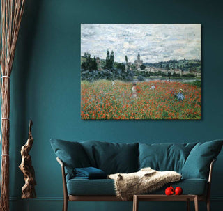 Claude Monet's Poppy field near Vétheuil impressionist landscape painting above teal loveseat, adding elegance to a modern, nature-inspired sitting area.