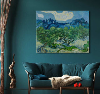 Vincent van Gogh - De Olijfbomen painting on teal-themed wall, featuring swirling olive trees, above modern teal sofa in a stylish living-room setting.