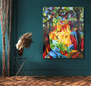 August Macke's Badende Meisjes oil painting depicts two stylized figures among vibrant foliage, blending cubist forms with modern artistry. Displayed on teal wall.