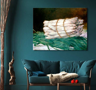 Édouard Manet's Een Bundel Asperges oil painting, depicting white asparagus on foliage, hangs above a teal loveseat in a cozy sitting area.