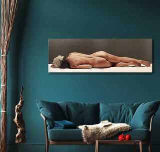 Luciano Ventrone's Sogno oil painting features a reclining nude, displayed above a teal sofa in a modern living room setting.