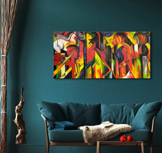Franz Marc’s 'Stallen' abstract oil painting with vibrant geometric shapes adorns a teal wall, enhancing a modern living room with expressive, hand-painted art.