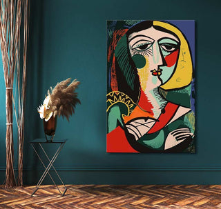 Picasso signature - Portrait of a Young Girl, a bold cubist oil painting, adds vibrant color and modern flair to this stylish interior with teal walls and wooden floors.