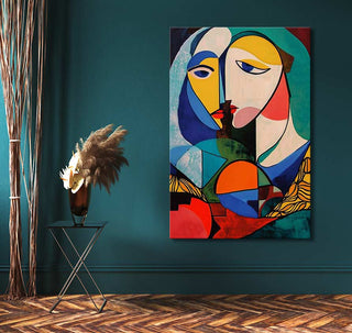 Cubist-style artwork, Picasso signature - Avond met Maanlicht, depicting two faces. Displayed in a modern interior with a side table and pampas grass.