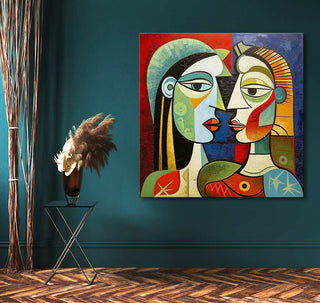 Cubist painting Picasso signature - Twee Dames on teal wall, featuring two abstract faces. Black metal side table with vase, pampas grass, herringbone wood floor.