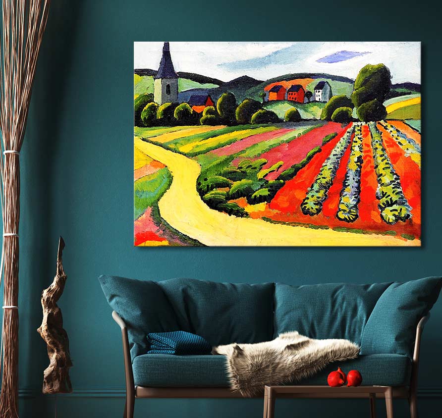 August Macke’s vibrant expressionist painting, Landschap met Kerk en Weg, displayed above a teal sofa in a modern living room, enhances decor with bold countryside imagery.