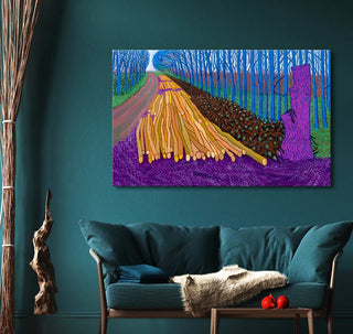 David Hockney's Winter Timber painting displayed above a teal sofa, showcasing blue trees and logs. Ideal for modern art enthusiasts, ready to hang.
