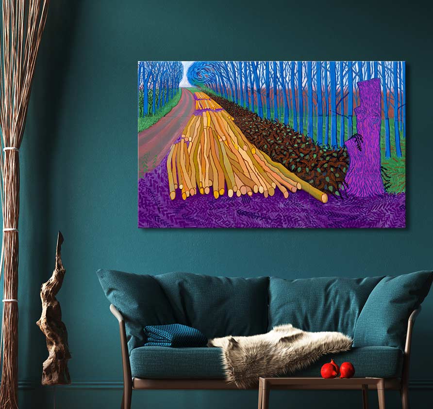 David Hockney's Winter Timber painting displayed above a teal sofa, showcasing blue trees and logs. Ideal for modern art enthusiasts, ready to hang.