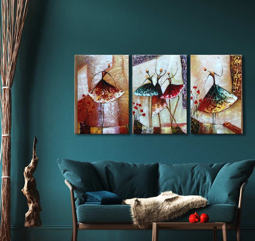Triptych oil painting Vreugdedans showing five abstract dancers with colorful skirts, displayed above a teal sofa. Hand-painted on museum-quality canvas.
