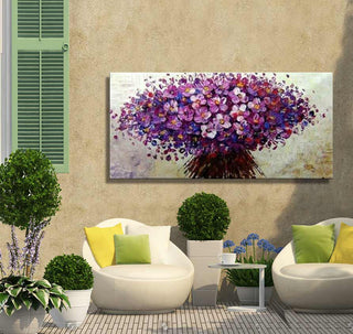 Bitterzoet – Dikke olieverf op canvas (160x80cm) depicting vibrant purple blossoms, set in a cozy patio nook with modern chairs and lush greenery.