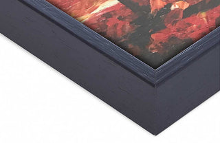 Close-up of Zwarte Baklijst, a dark wooden frame with mitered corner, showcasing detailed grain. Features a white mat and reddish abstract artwork inside.