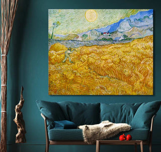 Vincent van Gogh's Korenveld achter Saint Pau Ziekenhuis oil painting on canvas, framed, displayed above a teal sofa in a modern living room.